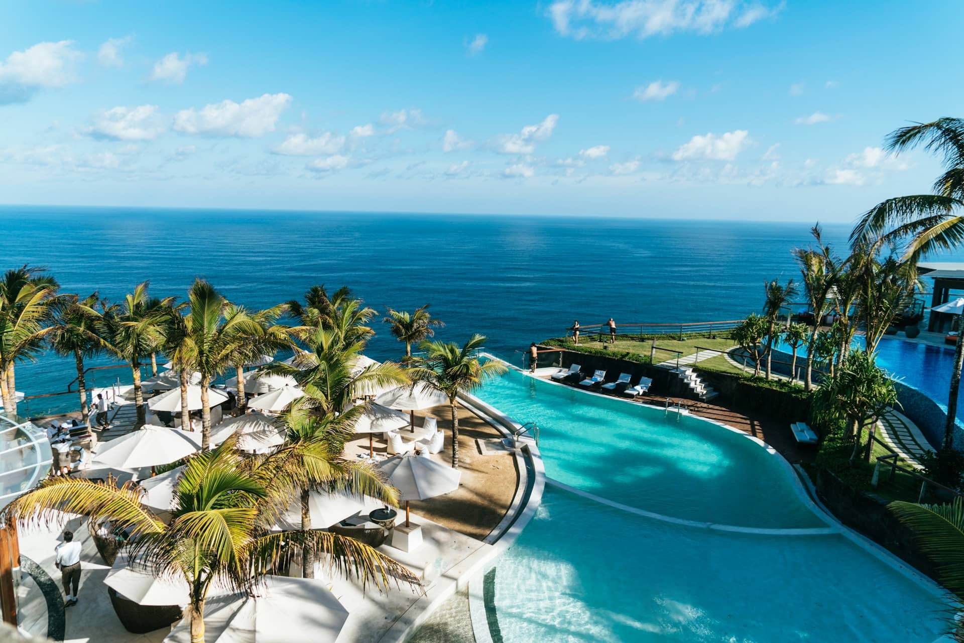 Poolside sunbeds and umbrellas at a resort