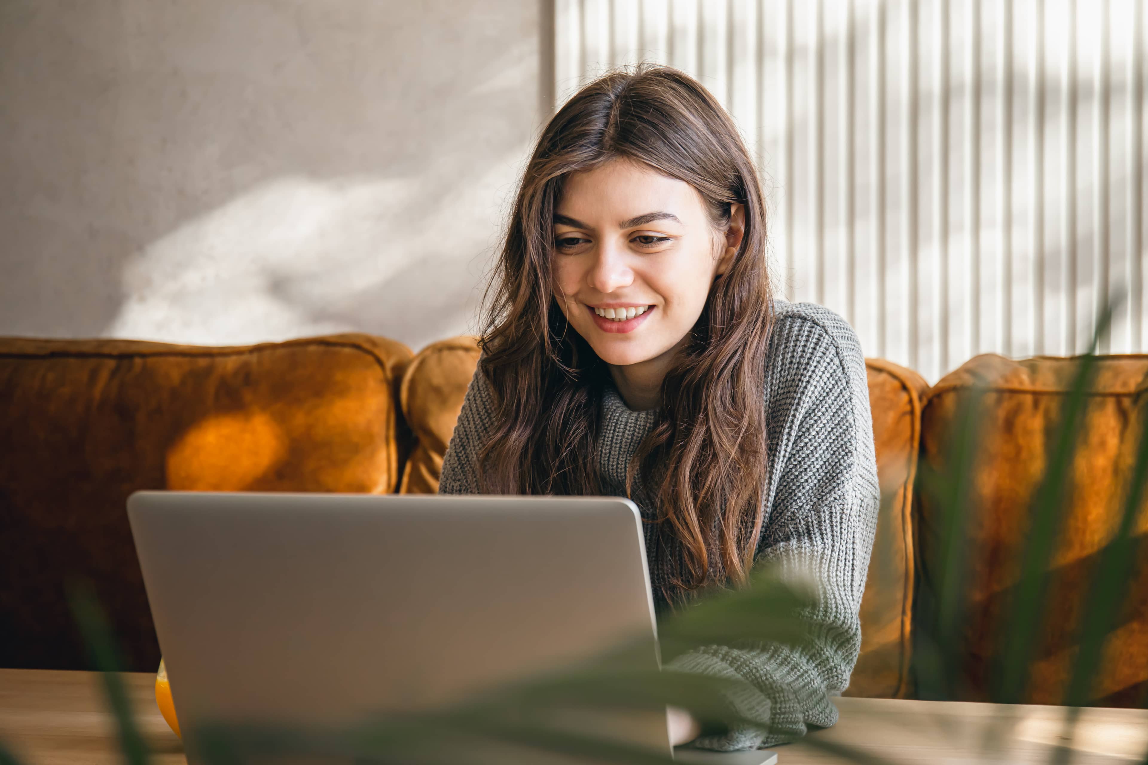 Woman buying a hotel gift voucher on her laptop