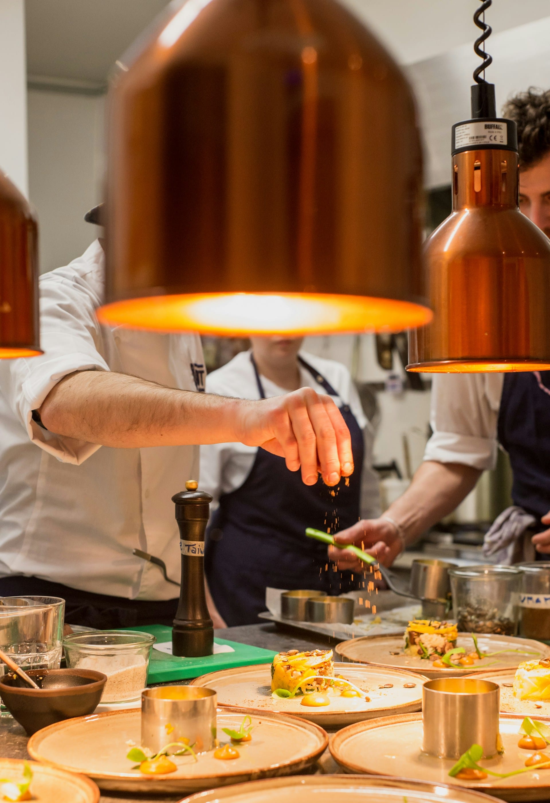 Chef preparing a plated course