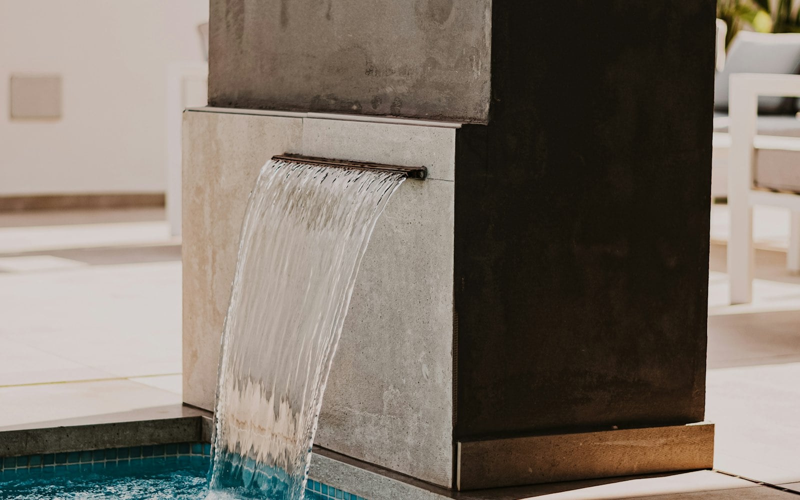 Poolside wellness scene behind the Turneo spa catalogue mockup